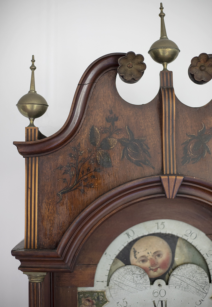 Tall Case Clock, bonnet detail, c, 1797. Gift of Betty Wold Johnson & Douglas F. Bushnell. The original label inside the waist door reads, “Made and sold by Matthew Egerton, Junior, Joiner and Cabinetmaker, New Brunswick, New Jersey.”